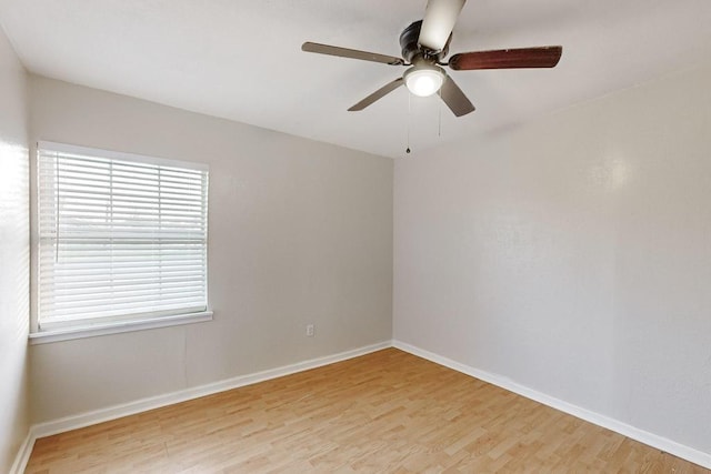 spare room with ceiling fan and light hardwood / wood-style floors