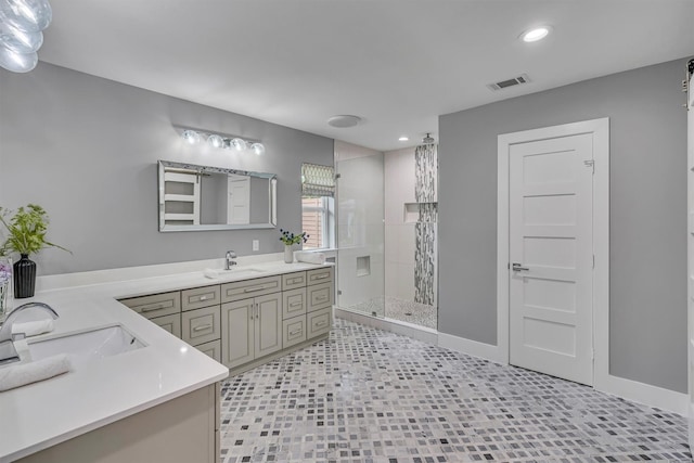 bathroom featuring vanity and a shower with shower door