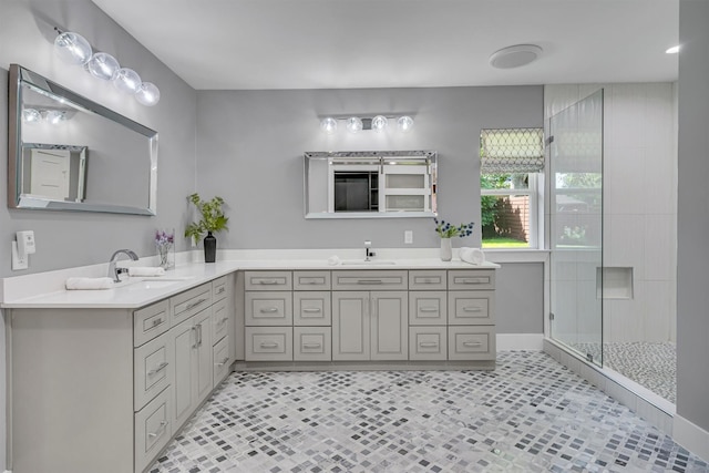 bathroom with an enclosed shower and vanity