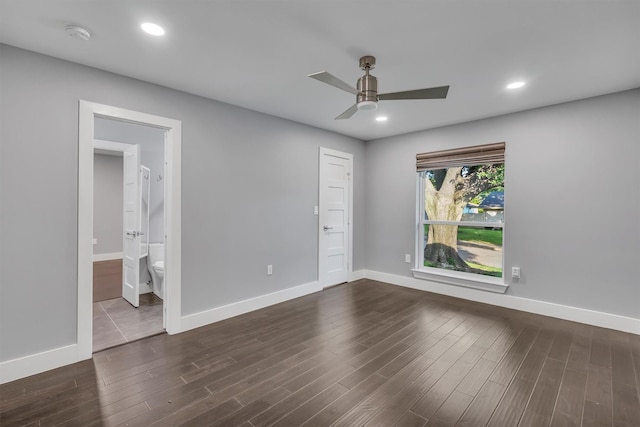 unfurnished bedroom with ensuite bathroom and ceiling fan