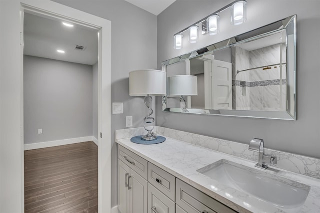 bathroom featuring vanity and walk in shower