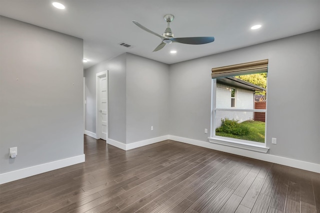 unfurnished room featuring ceiling fan and dark hardwood / wood-style flooring