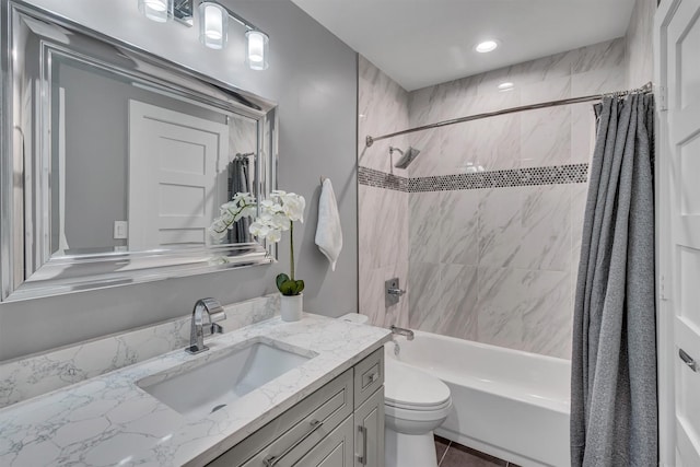 full bathroom featuring toilet, vanity, and shower / bath combo