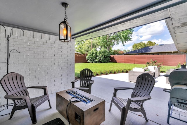 view of patio / terrace featuring an outdoor living space with a fire pit and area for grilling