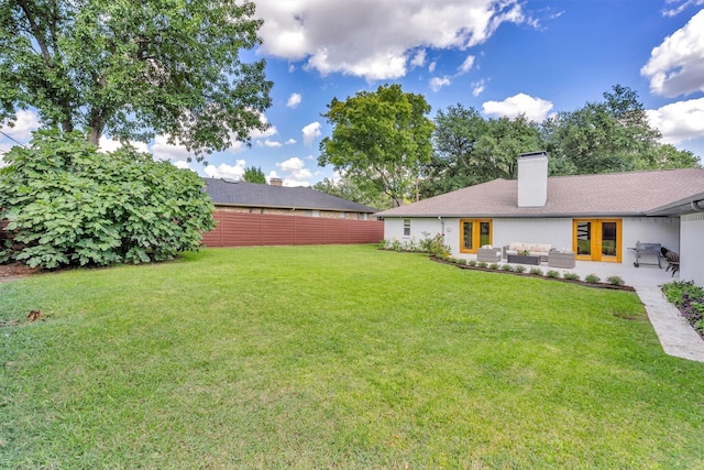 view of yard featuring french doors, a patio, and outdoor lounge area