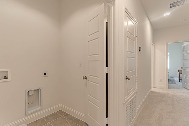 laundry area featuring washer hookup, hookup for an electric dryer, and light tile patterned floors