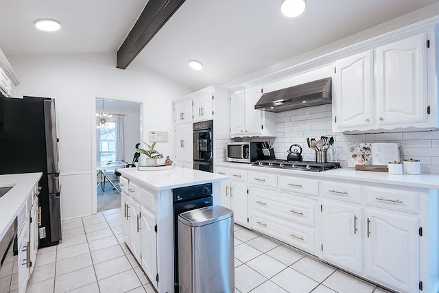 kitchen with range hood, lofted ceiling with beams, decorative backsplash, white cabinets, and appliances with stainless steel finishes