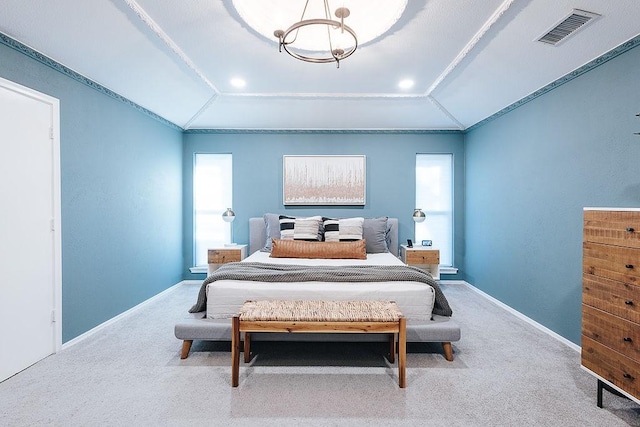 carpeted bedroom with vaulted ceiling and crown molding