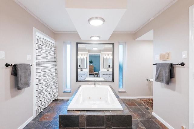 bathroom with ornamental molding and tiled bath