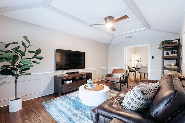 living room with ceiling fan, dark hardwood / wood-style flooring, and vaulted ceiling