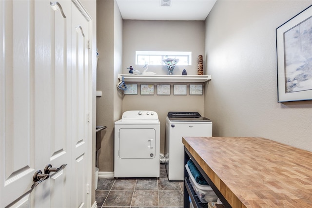 clothes washing area featuring washing machine and clothes dryer