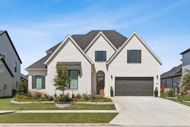 view of front facade featuring a front yard and a garage