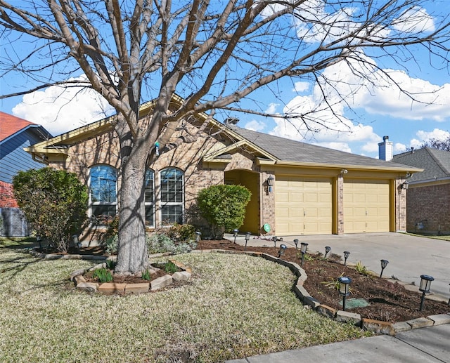 view of front of property with a front yard and a garage