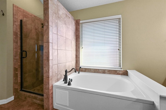 bathroom with a textured ceiling and plus walk in shower