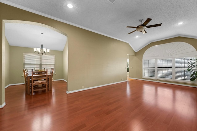 spare room featuring a textured ceiling, a healthy amount of sunlight, lofted ceiling, and ceiling fan with notable chandelier