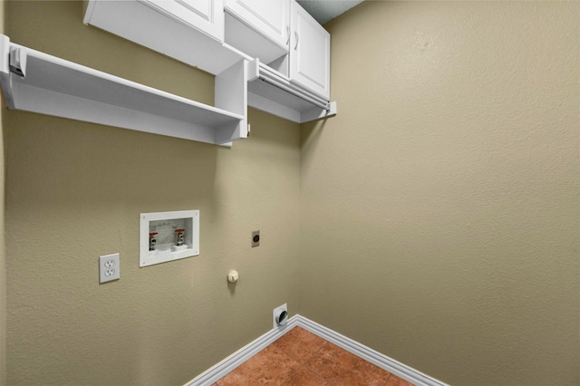 clothes washing area featuring electric dryer hookup, washer hookup, cabinets, tile patterned flooring, and hookup for a gas dryer