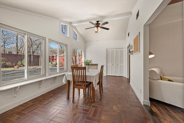 dining area with ceiling fan, dark parquet floors, and high vaulted ceiling