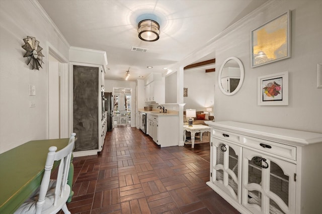 hall featuring ornamental molding, dark parquet flooring, and sink