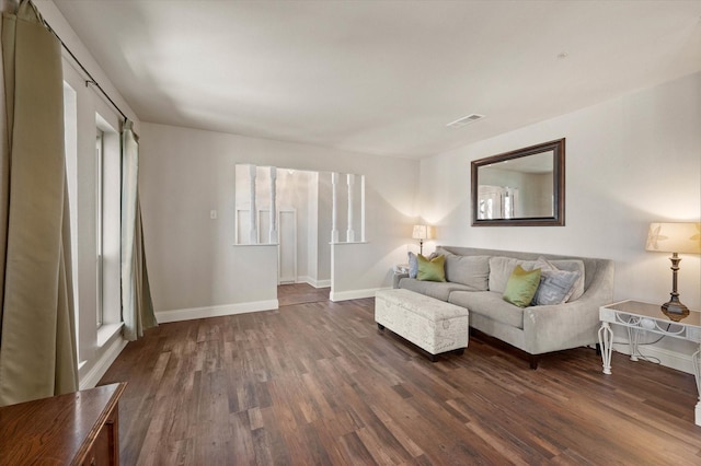 living room with dark hardwood / wood-style floors