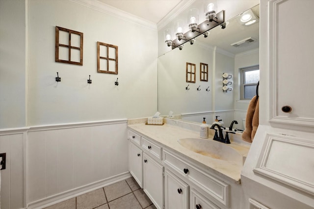 bathroom with ornamental molding, tile patterned flooring, and vanity