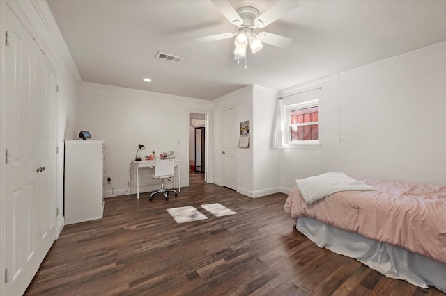 bedroom featuring ceiling fan, dark hardwood / wood-style floors, and ornamental molding