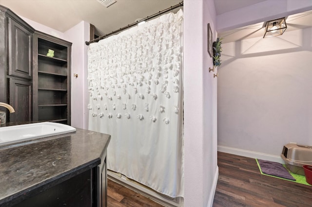 bathroom with wood-type flooring and vanity