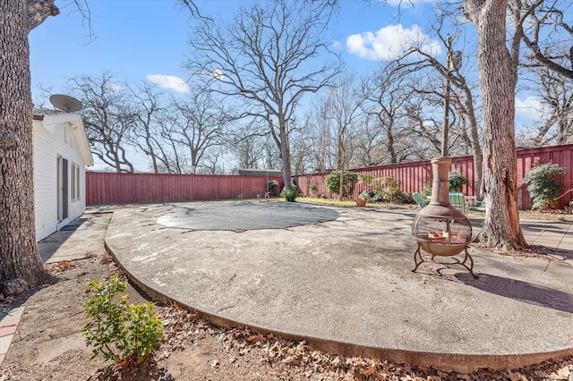 view of yard with a patio area and an outdoor fire pit