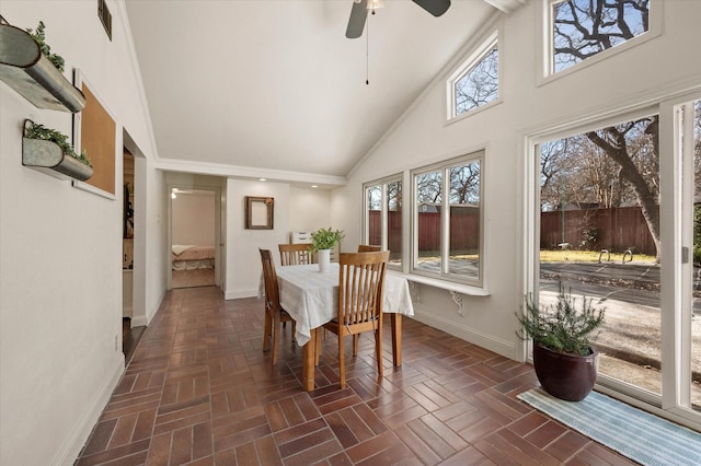 unfurnished sunroom featuring ceiling fan and lofted ceiling