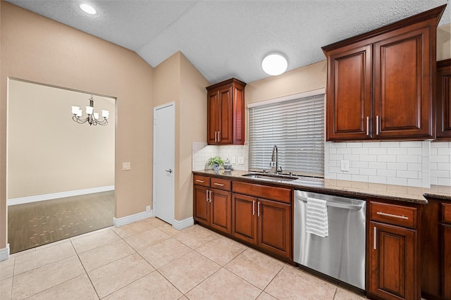 kitchen featuring stainless steel dishwasher, a textured ceiling, light tile patterned floors, an inviting chandelier, and sink