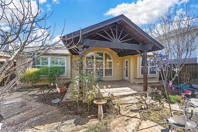 back of property featuring a patio