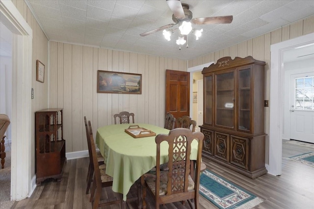 dining space featuring hardwood / wood-style flooring and ceiling fan