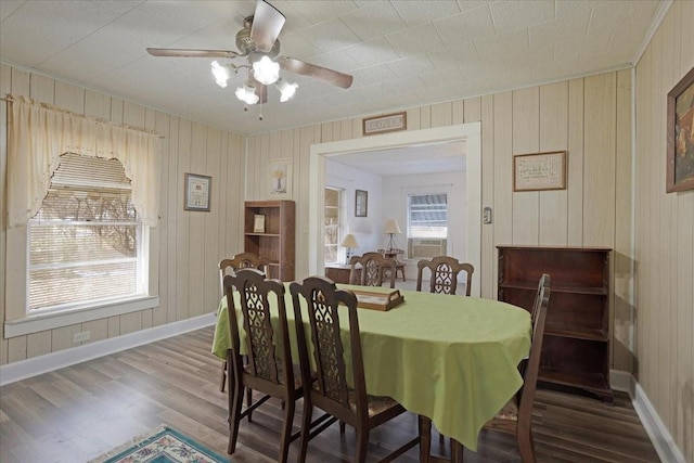 dining space with ceiling fan and hardwood / wood-style floors