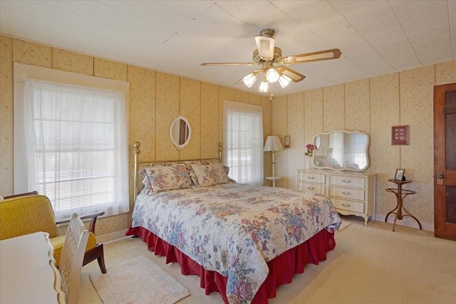 bedroom with ceiling fan and carpet flooring