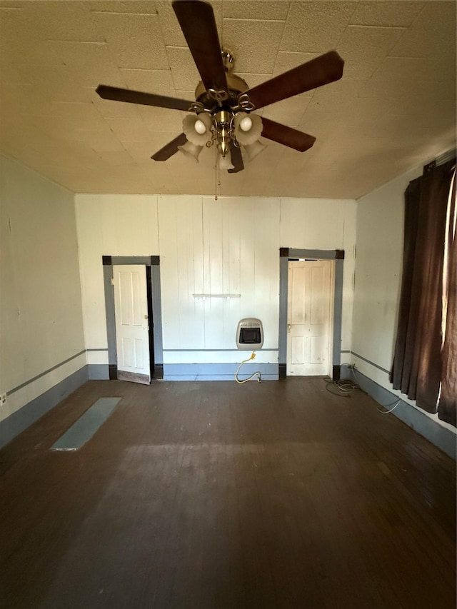 interior space featuring ceiling fan and heating unit