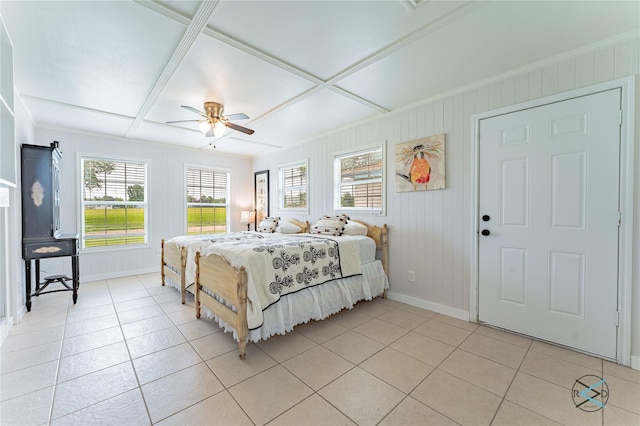 tiled bedroom featuring ceiling fan and coffered ceiling