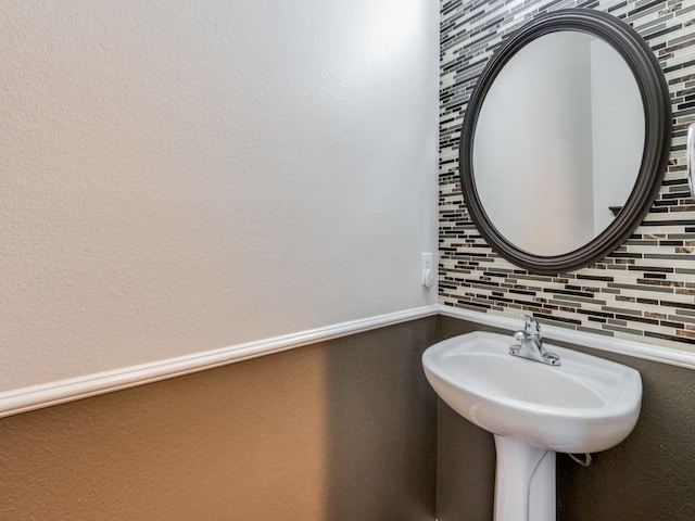 bathroom featuring tasteful backsplash