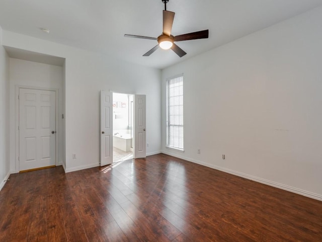 unfurnished room featuring ceiling fan and dark wood-type flooring