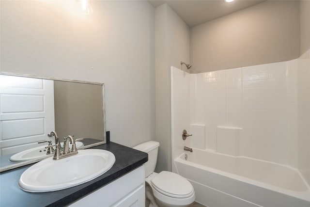 full bathroom featuring toilet, vanity, and shower / bathtub combination