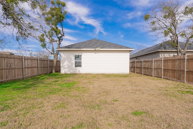 back of house featuring a yard