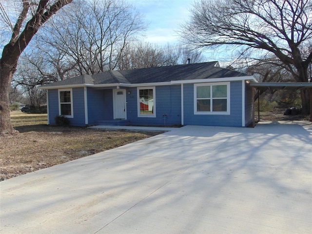 ranch-style home with a carport