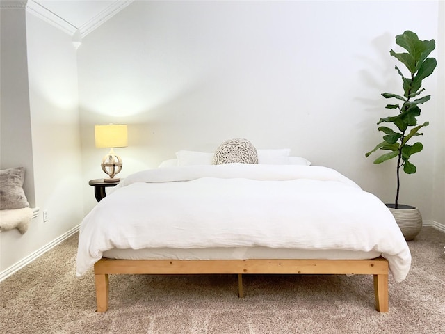 carpeted bedroom featuring ornamental molding