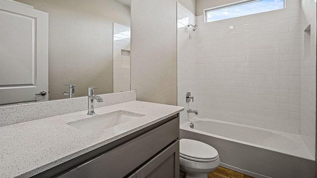 full bathroom with toilet, washtub / shower combination, and vanity