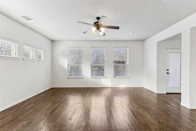 unfurnished room with ceiling fan and dark hardwood / wood-style floors