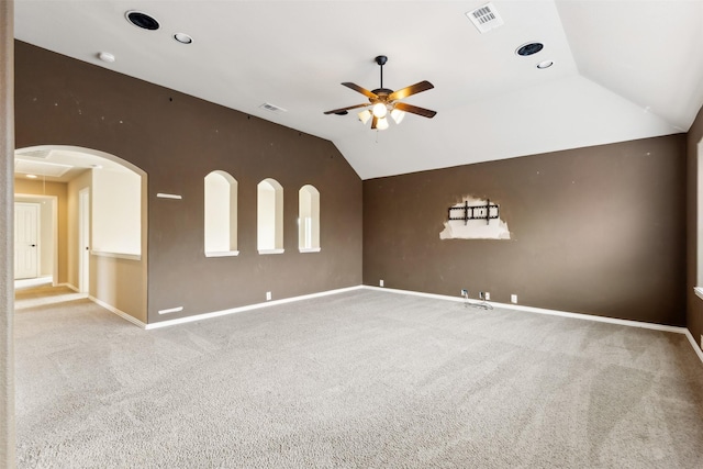 carpeted spare room with lofted ceiling and ceiling fan