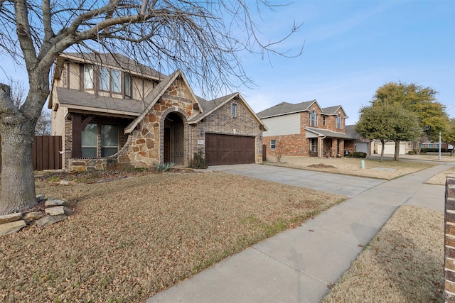 view of front of home with a front yard and a garage