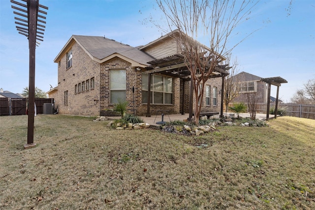 view of front of home with central AC, a patio area, a front yard, and a pergola