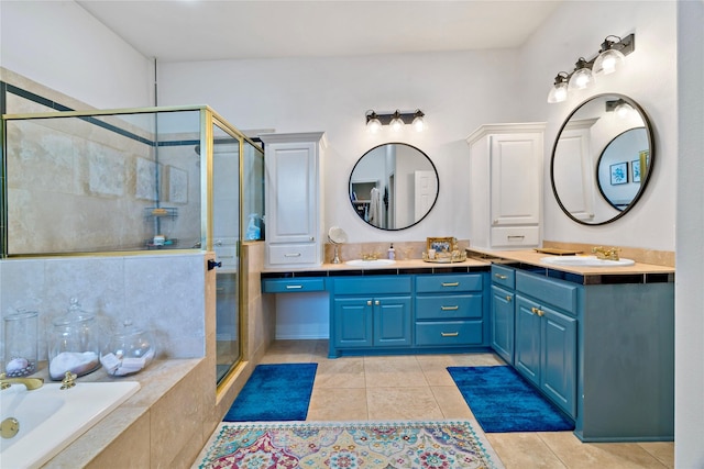 bathroom featuring shower with separate bathtub, tile patterned floors, and vanity