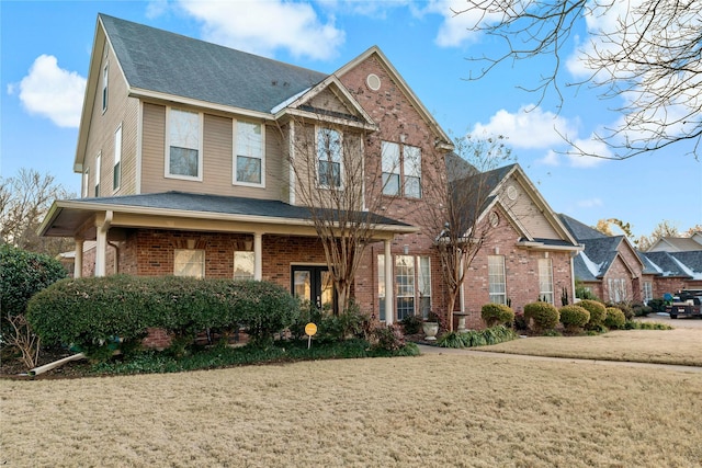 craftsman-style house with a front lawn