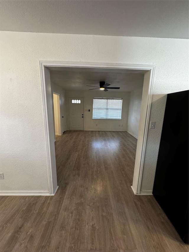 hall featuring dark wood-type flooring