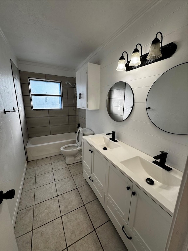 full bathroom featuring toilet, tile patterned flooring, crown molding, and tiled shower / bath